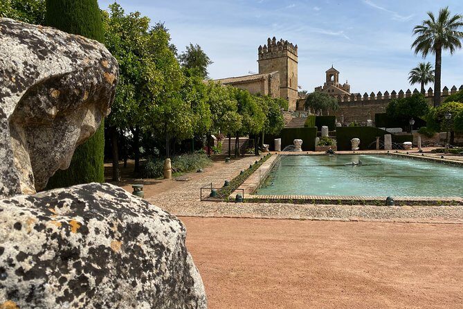 Guided tour of the Alcazar de los Reyes Cristianos in Spanish - Price value check: what $24.57 buys you in a historic courtyard